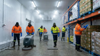 Cleaning crew servicing a refrigerated cold storage food warehouse in Africa