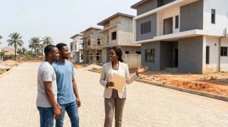 Real estate agent showing a residential estate to a couple of buyers in Lagos, Nigeria